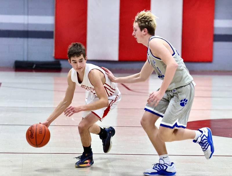PCA's Matthew Gibson drives against Princeton's Rockne Berlinski in Thursday's JV game at Howard Hoffman Memorial Gymnasium.