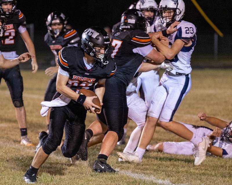 FCW quarterback Brezdyn Simons (23) goes around end on a keeper during the Falcons' Week 5 win over Ridgewood at the Wood Shed in rural Streator.