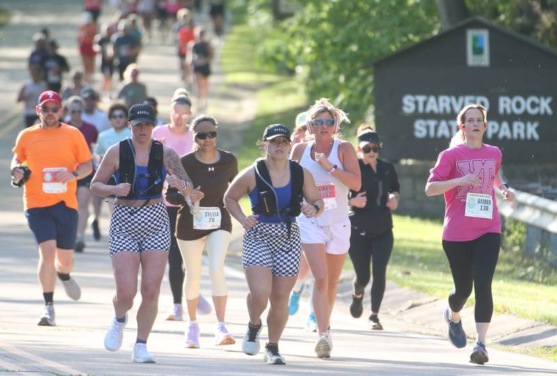 A group of runners jog in the Starved Rock Country half-marathon on Saturday, May 10, 2025 at Starved Rock State Park.