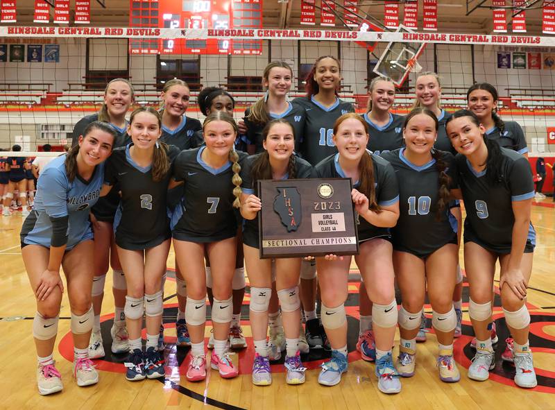 Willowbrook celebrate winning against Oak Park-River Forest at the 4A girls varsity volleyball sectional final match at Hinsdale Central high school on Wednesday, Nov. 1, 2023 in Hinsdale, IL.