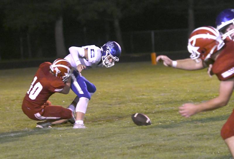 Newman quarterback JJ Castle drops the ball as Morrison's Donny Reavy comes in for the sack during action on Friday, Aug. 26, 2022.