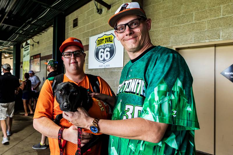 Joliet residents, Tyler Bruner, Freedom, and Bobby Hensley, Jr. wear their favorite jerseys for the Joliet Slammers Dog Day event, presented by University of St. Francis, on Aug. 10, 2025.