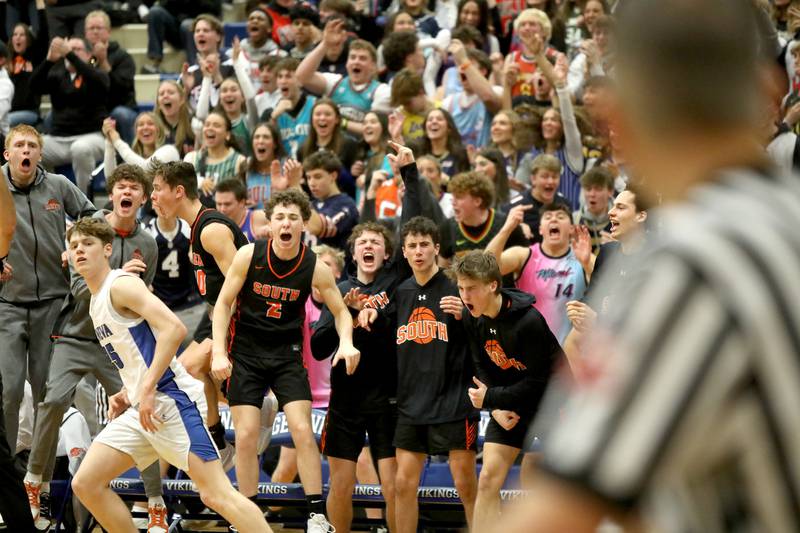 Wheaton Warrenville South’s bench erupts as the game is tied in the final seconds of a game on Friday, Jan. 24, 2025 at Geneva.