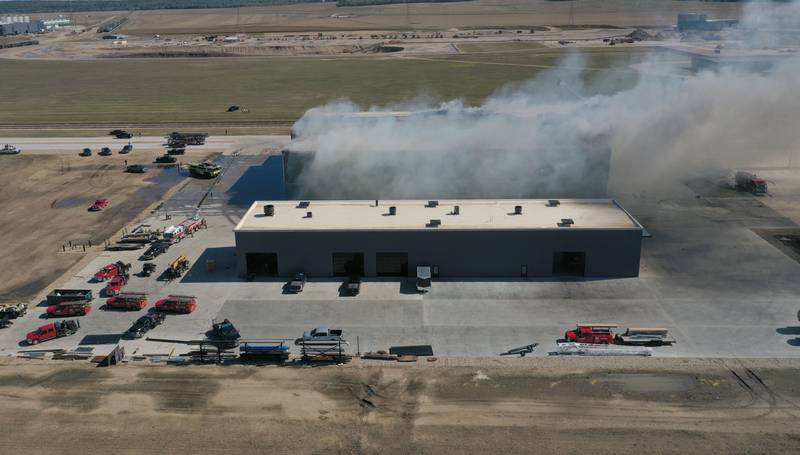 Smoke billows from Marquis Energy as firefighters work to control a structure fire on Wednesday, Oct. 8, 2025 in Hennepin. The fire was upgraded to a 5th alarm dispatching the (MABAS) Mutual Aid Box Alarm System. The fire broke out around 11a.m.