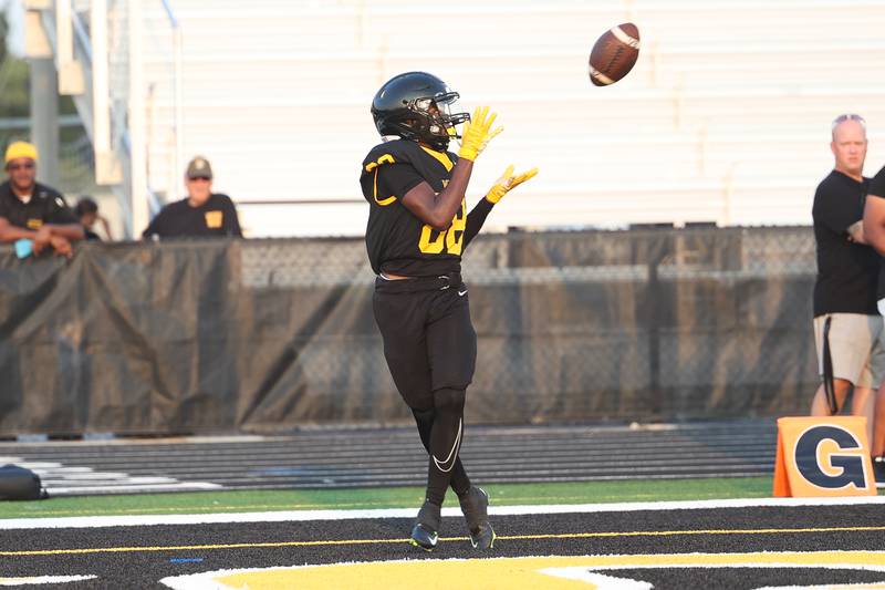 Joliet West’s Juan Rico finds an open Marion Starks for the Tigers first touchdown of the season against Shepard on Friday, Aug. 25, 2023 in Joliet.