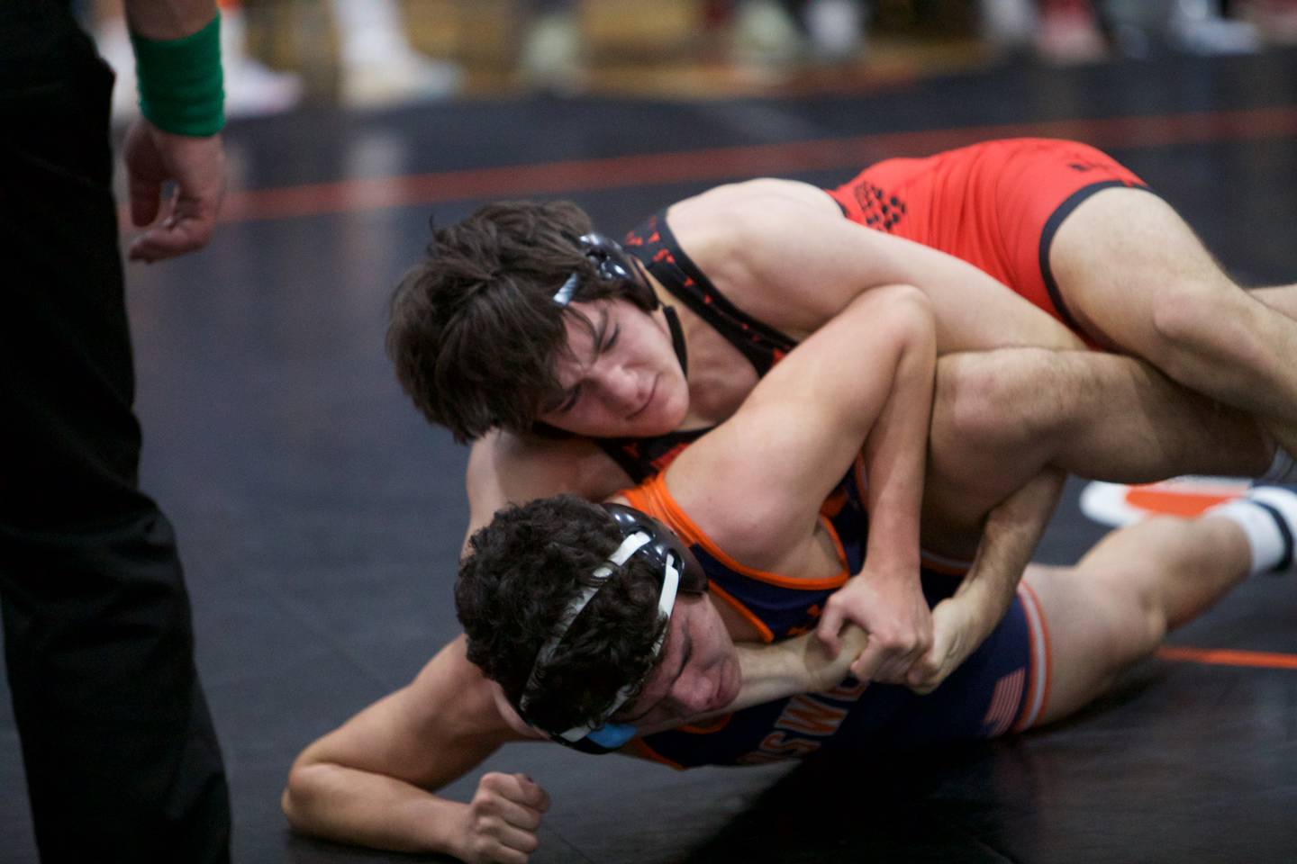 Naperville Central's John Carren and Oswego's Ethan Torres compete in the 165 lb. class at the St. Charles East wrestling meet on Saturday, Dec.2, 2023 in St. Charles.