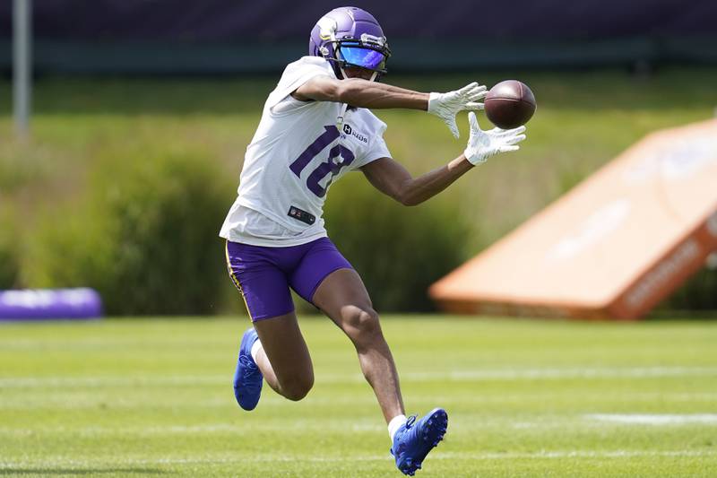 Minnesota Vikings wide receiver Justin Jefferson (18) participates in drills during the NFL football team's training camp in Eagan, Minn., Wednesday, July 27, 2022. (AP Photo/Abbie Parr)
