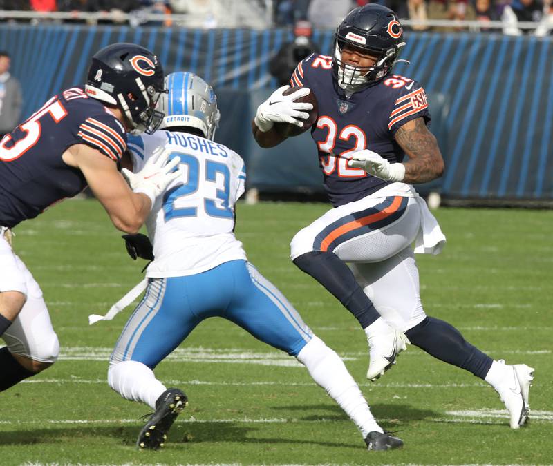 Chicago Bears running back David Montgomery gets a block on Detroit Lions cornerback Mike Hughes from tight end Cole Kmet during their game Sunday, Nov. 13, 2022, at Soldier Field in Chicago.