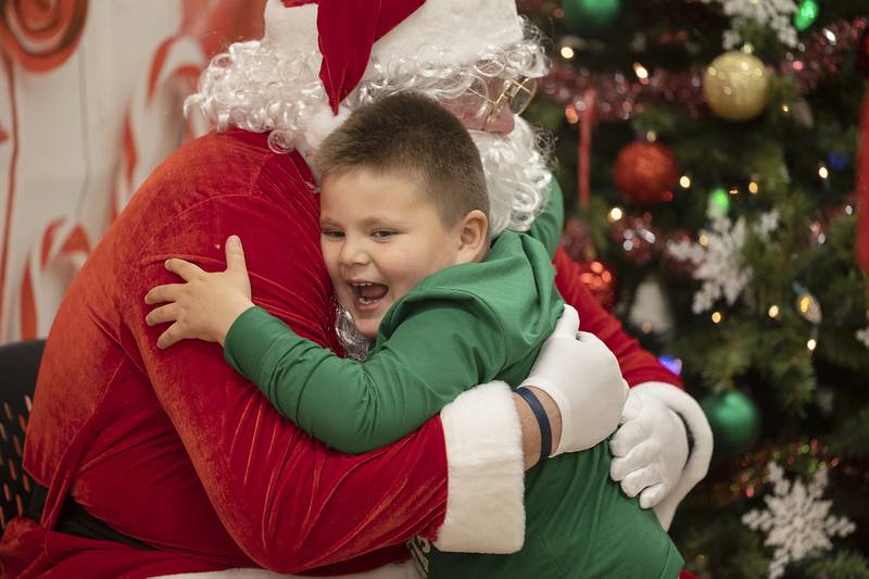 Everson Ward, 5, of Sterling excitedly hugs Santa on Wednesday, Dec. 11, 2024, during the Whiteside County Senior Center’s Sandwiches with Santa event. Kids and families had a chance to have a meal, visit Santa and enjoy a number of activities.