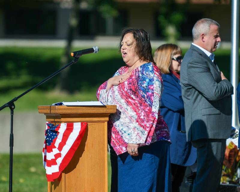 Christine Wild Monteiro sings "The Star Spangled Banner" during a dedication ceremony marking the completion of phase one of the DeKalb Elks Veteran’s Memorial Plaza in DeKalb Saturday, Oct. 1, 2022.