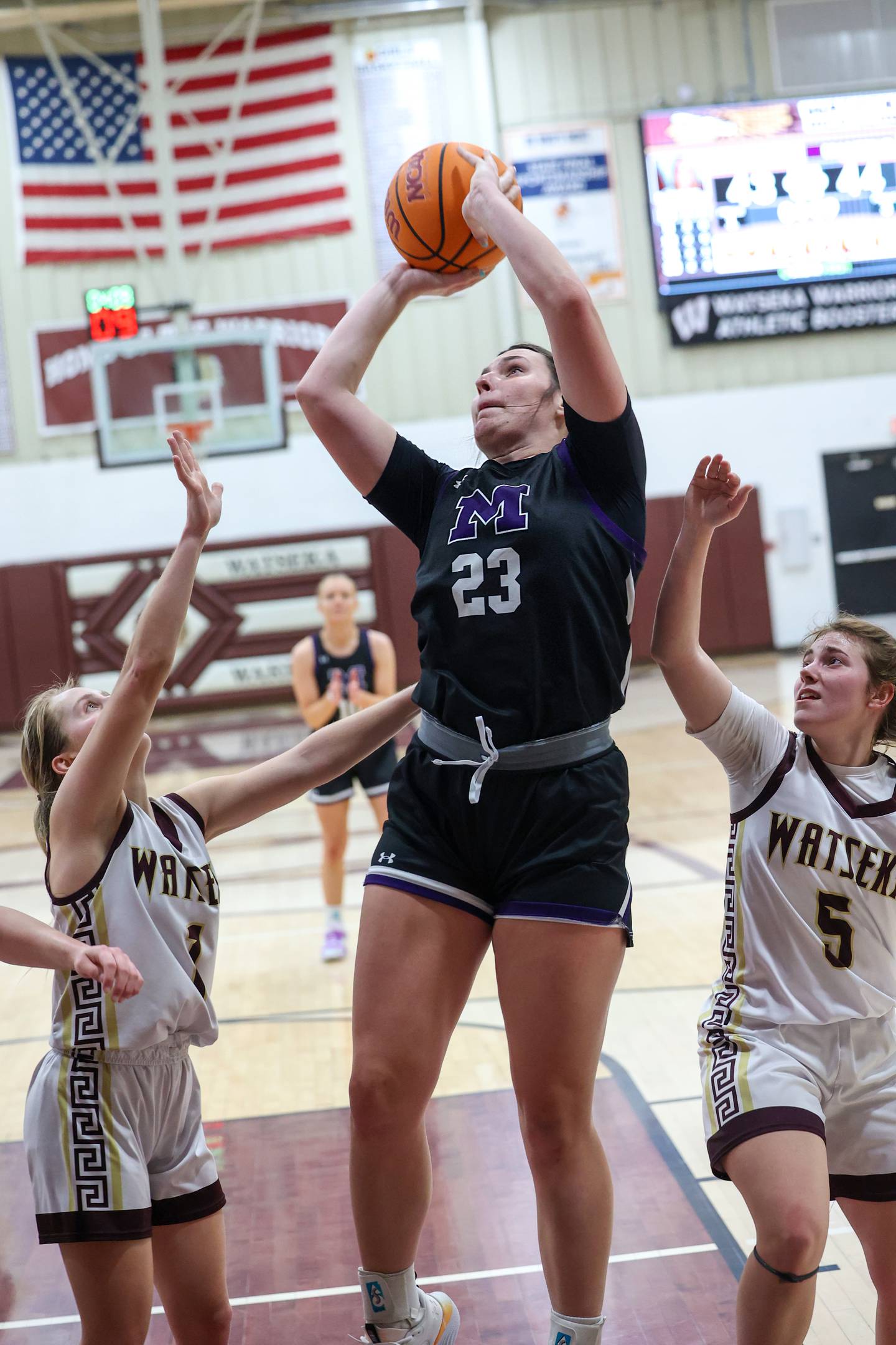 Manteno's Maddie Gesky goes for a layup past Watseka/Milford's Kyah Westerfield, right, and Kami Muehling during Manteno's 57-52 victory on Wednesday, Jan. 21, 2026.