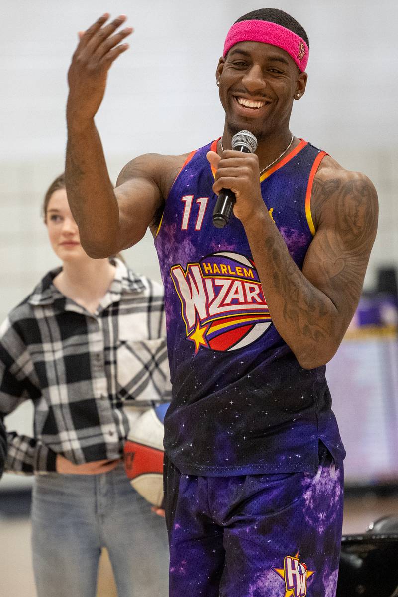 Kamil “Dragon” Brown (77) of the Harlem Wizards talks into microphone on Wednesday, April 16, 2025 at Woodland High School in Streator.