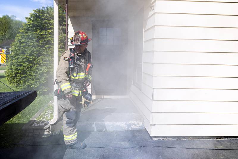 Rock Falls Fire Captain Nate Hartman trains at a home in Rock Falls Wednesday, May 1, 2024.