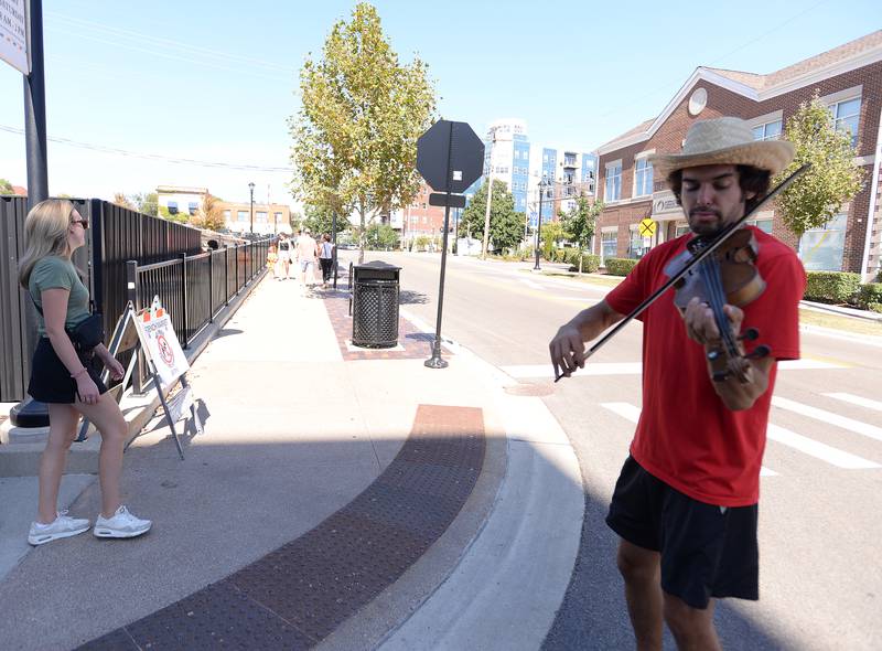 Mike Horvath of Orland Park performs near the Wheaton Farmers Market during the Music on Main event held downtown Wheaton Saturday, Sept. 21, 2024.
