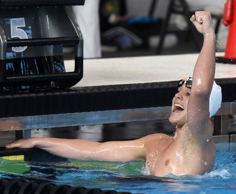 Hinsdale Central’s Joshua Bey celebrates after winning the 200-yard individual medley with a time of 1:44.89 during the boys state swimming finals at FMC Natatorium on Saturday, Feb. 24, 2024 in Westmont.
