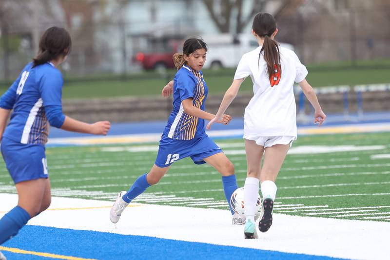 Joliet Central’s Ariadna Arciniega works the ball against Plainfield East on Thursday, April 11, 2024.
