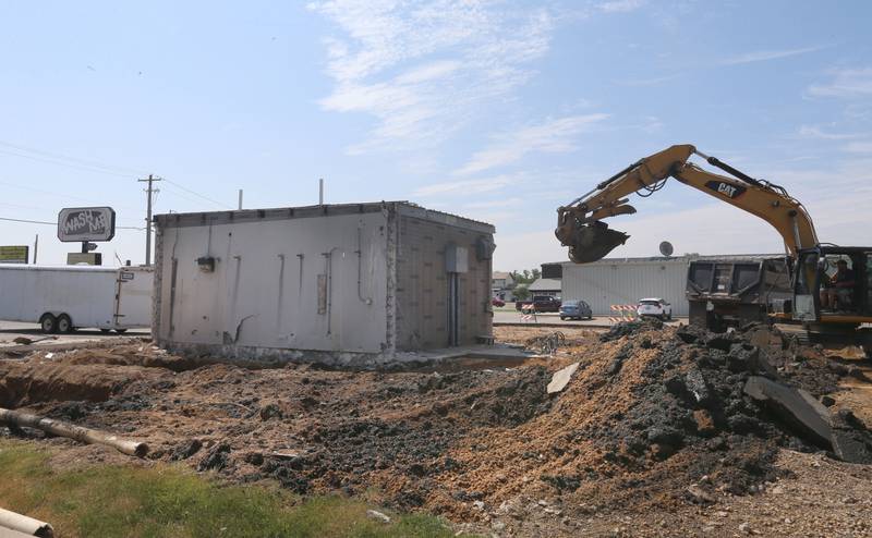 An excavator demolishes the Wash Me car wash on Wednesday, June 7, 2023 in Princeton.