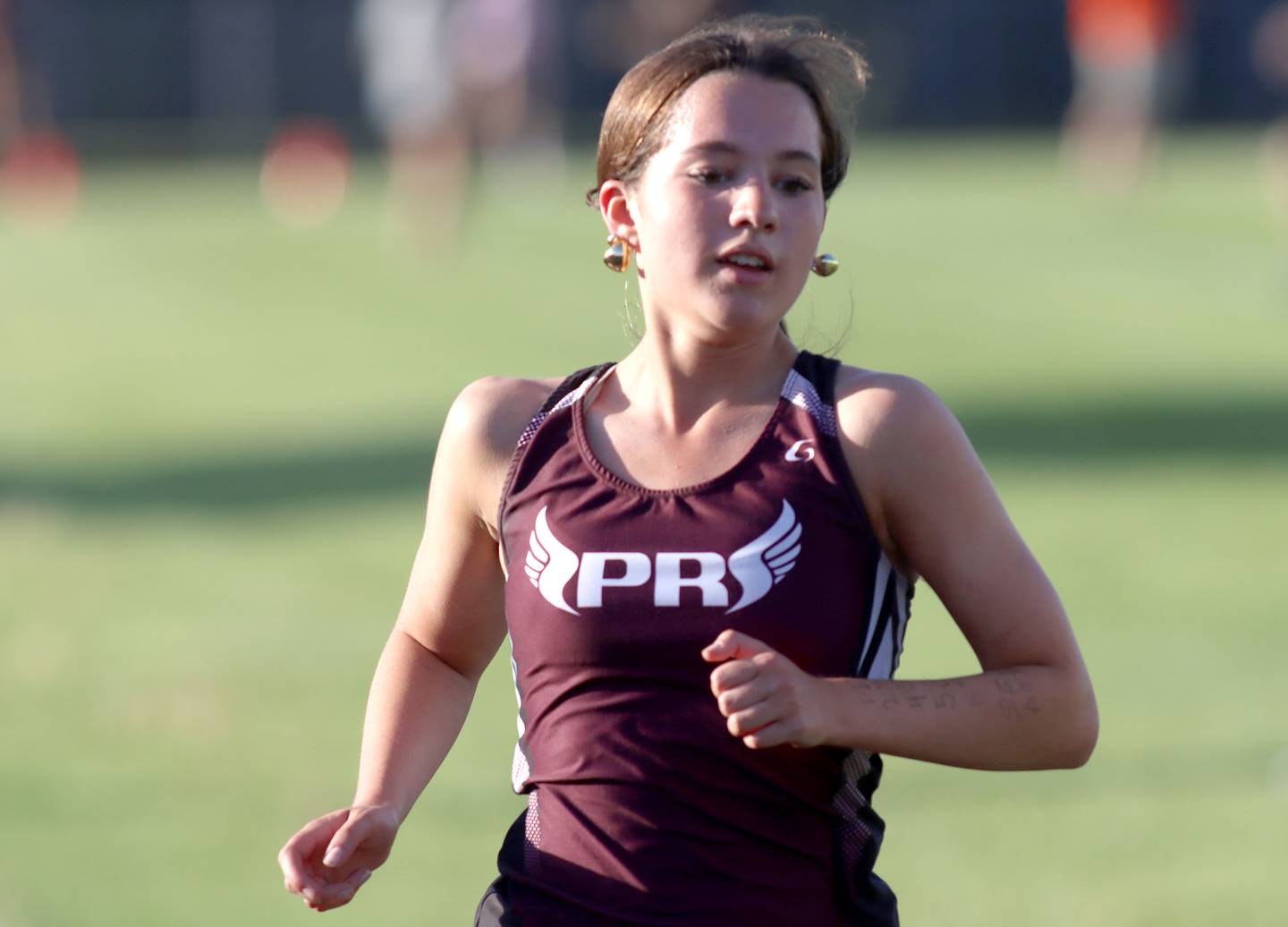 Prairie Ridge’s Emaline Foster cruises in the 3200-meter run in IHSA Class 2A Girls Sectional Track action at Genoa-Kingston School in Genoa on Friday, May 16, 2025.