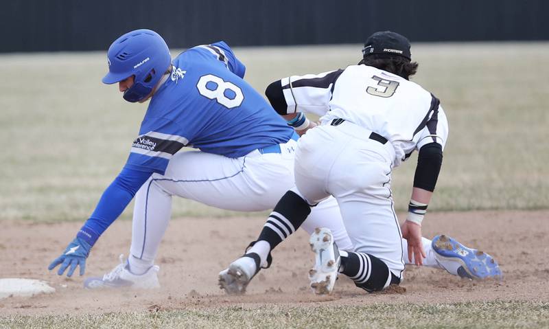 Burlington Central's Mason Rosborough is tagged out by Sycamore's Hunter Britz on a stolen base attempt during their game Tuesday, March 21, 2023, at Sycamore Community Park.