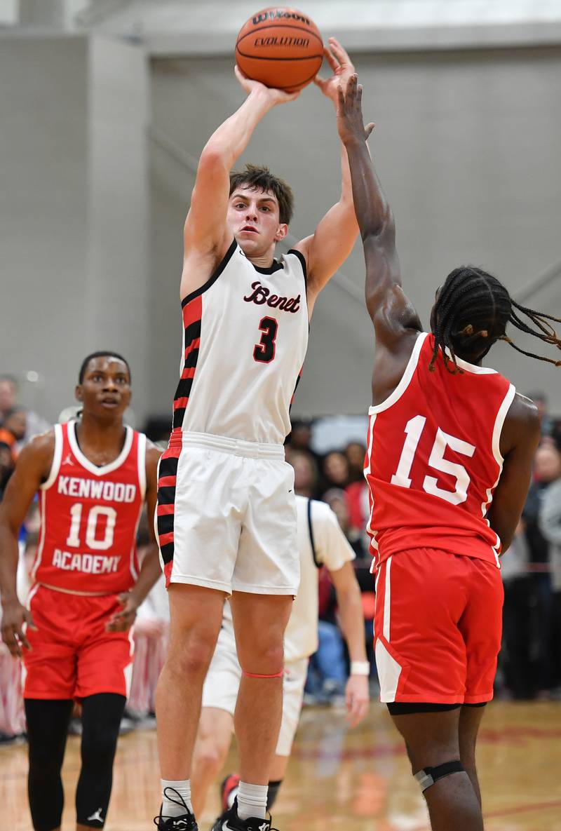 Benet's Brady Kunka (3) shoots a jump shot from between two Kenwood defenders during a "When Sides Collide" invitational game on Jan. 21, 2023 at Benet Academy in Lisle.