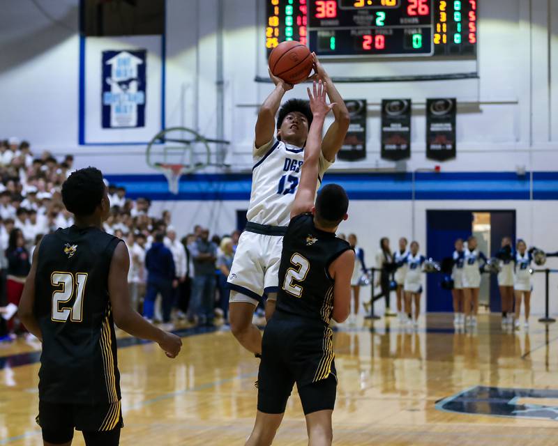 Downers Grove South's Richard Gasmen (13) shoots a jumper during basketball game between Hinsdale South at Downers Grove South. Dec 1, 2023.