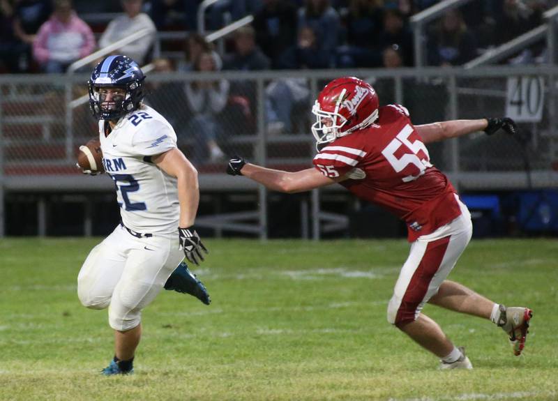 Bureau Valley's Elijah Endress runs by Hall's Jacob Mongan on Friday, Sept 8, 2023 at Richard Nesti Stadium.