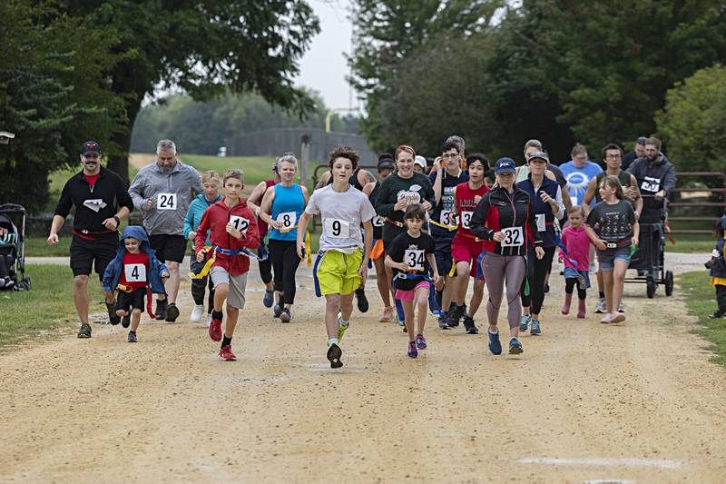 Thirty-five runners fire off the line during the Zom-G 5K Saturday, Sept. 16, 2023 in Dixon.