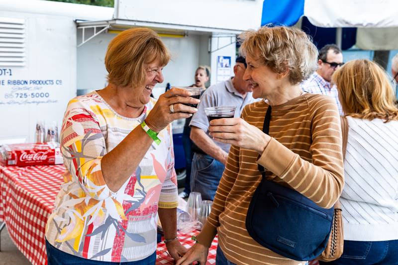 Channahon residents Peg Arnold and Karen Doyle enjoy a toast at the Slovenian Grape Harvest Festival at Rivals Park Picnic Grounds in Joliet on Sept. 29, 2024.
