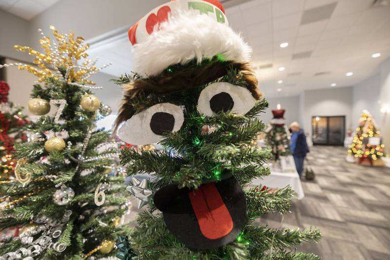 An Oscar the Grouch themed Christmas tree sits on display Thursday, Nov. 13, 2025. The unique tree and table settings are up for bid until Saturday at the McCormick Event Center in Rock Falls.