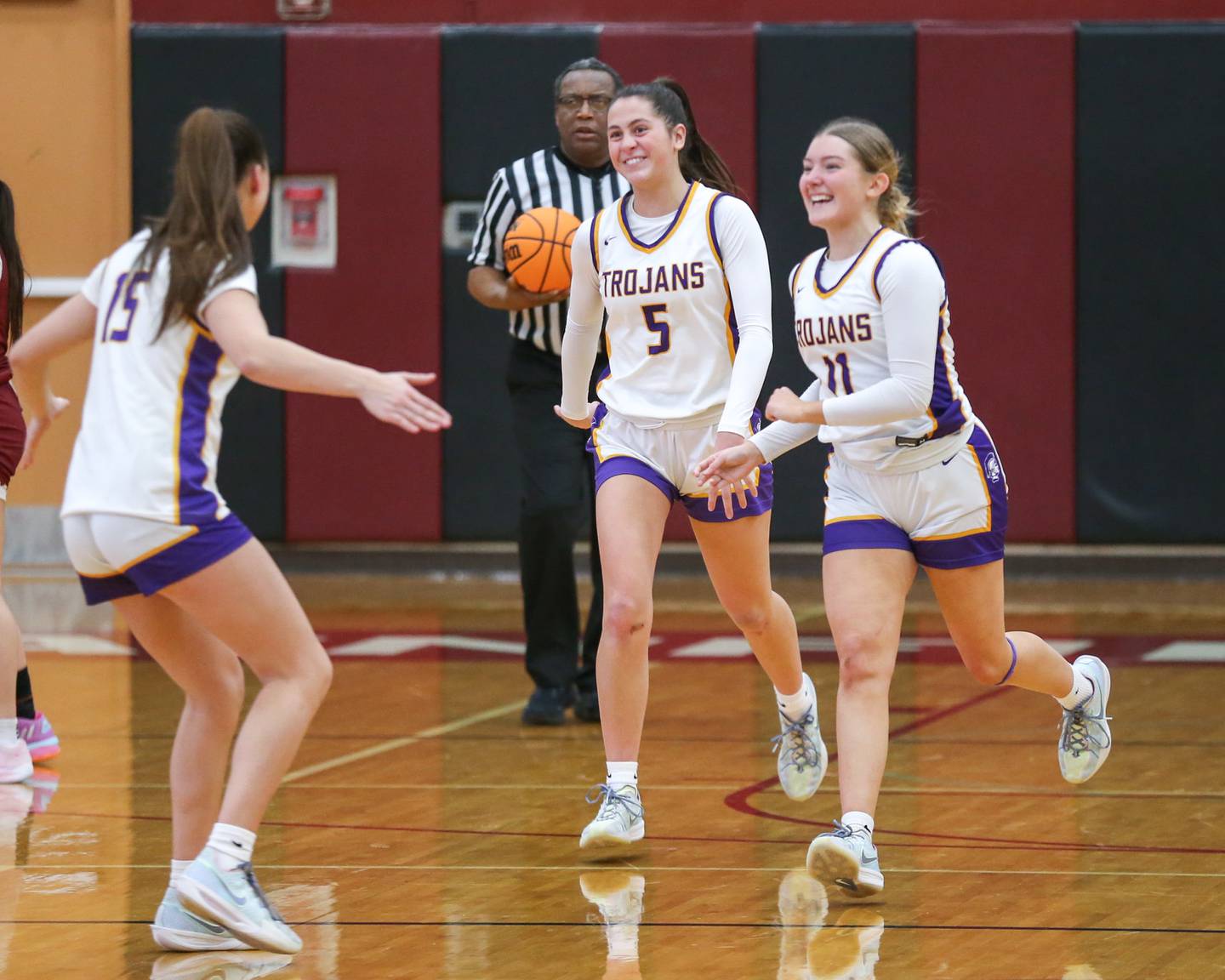 Downers Grove North celebrates the win in their Regional Final basketball game between Downers Grove North at Plainfield North. Feb 20, 2025 in Plainfield.