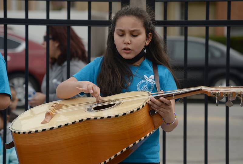 Jefferson Elementary School student Diana Rocha-Castro plays the guitar during District 98's Dia de los Niños celebration Friday April 29, 2022.