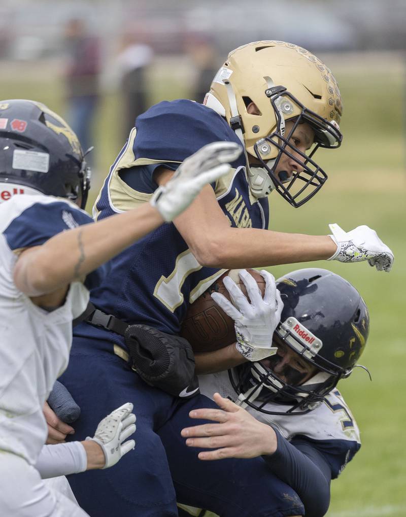 Polo’s Jordan Reed is tackled against Hiawatha Saturday, Nov. 1, 2025, in the 8-man football playoff quarterfinals.