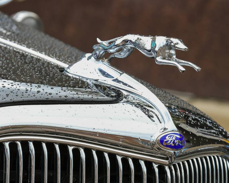 Water droplets collect on a 1934 All Steel Ford sedan after a short rain shower during the 24th annual Fizz Ehrler Memorial Turning Back Time Car Show in downtown Sycamore on Sunday, July 28, 2024, in Sycamore.