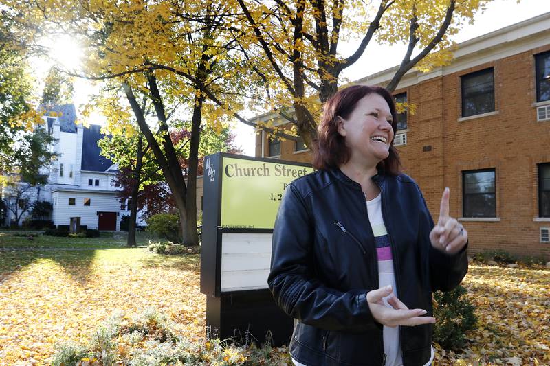Church Street Apartments tenant Becky Lucking talks on Friday, Nov. 5, 2021, about her one-bedroom apartment inside the newly redesigned apartment building, converted from the former Faith Lutheran High School and Immanuel Lutheran Church in Crystal Lake.
