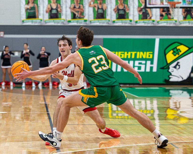 Braden Curran (33) of Hall looks to pass ball to teammate as Brady Sheedy (23) of Seneca attempts to deflect during game in the Shipyard Showdown on Tuesday, December 23, 2025 at Seneca High School in Seneca.