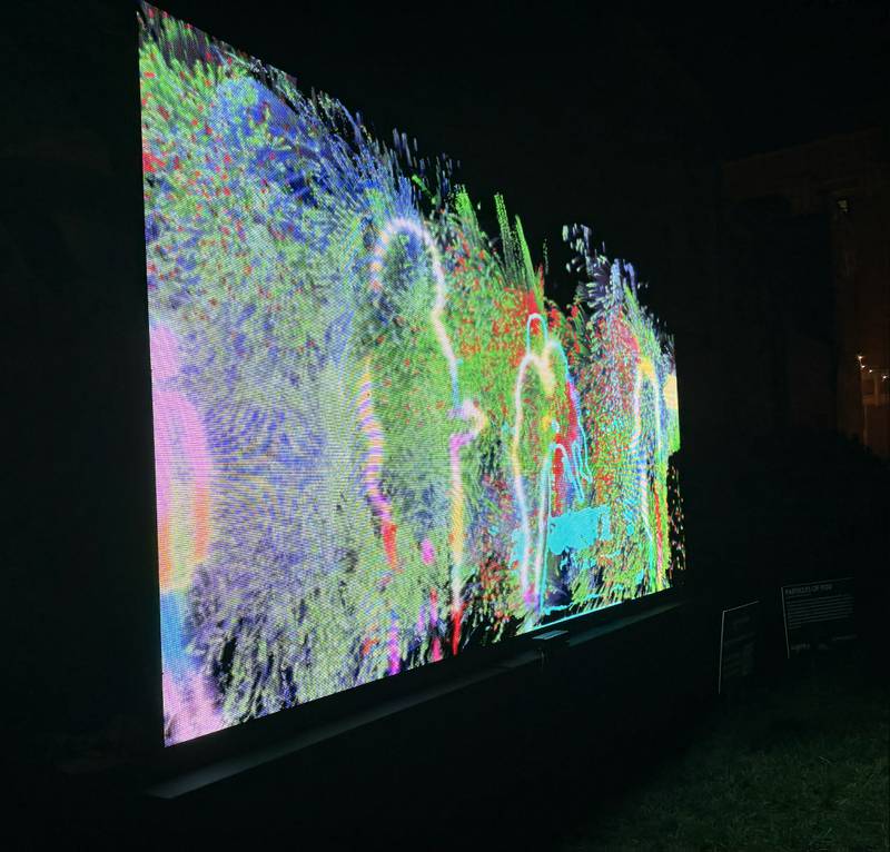 Silhouettes are on display at "Particles of You," one of the installations on display Oct. 10, 2025 as part of Lumenaura in downtown Aurora.
