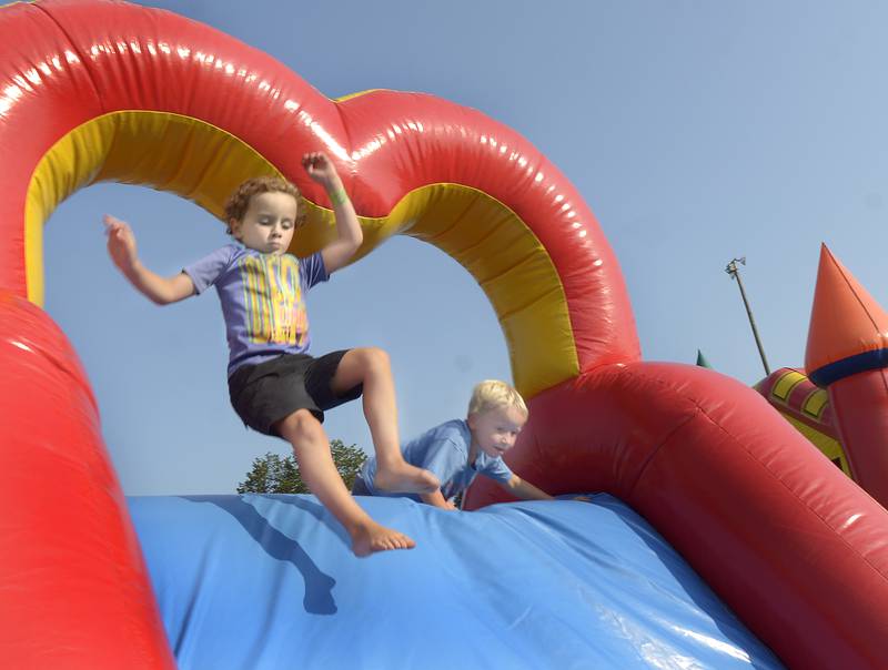 Plenty of children enjoyed two bounce house slides Tuesday evening at Peck Park in Ottawa during National Night Out. Numerous games and family activities took place during the three hour event.