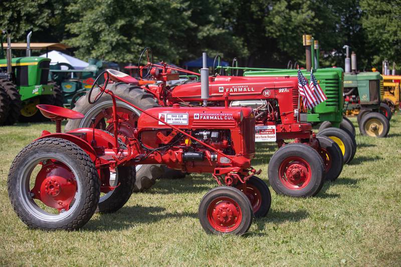 Tractors are seen Saturday, August 6, 2022 at the Living History Antique Equipment Association show in Franklin Grove. The LHAEA demonstrates the equipment used from a bygone era such as threshing, rock crushing, corn shelling and saw milling.