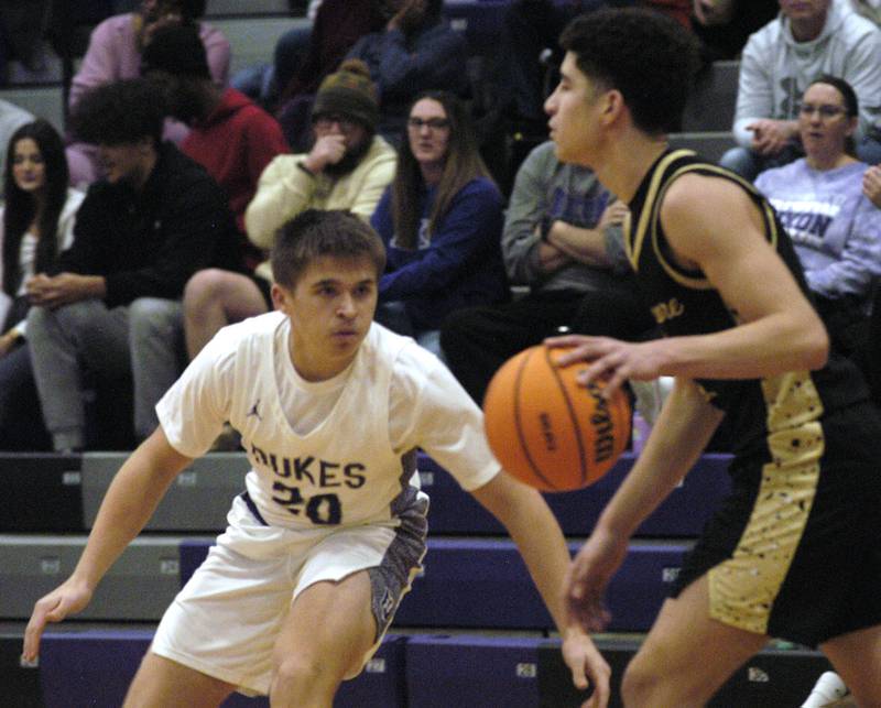 Dixon's Cameron Foulker  applies defense to a Sycamore player. The Dixon Dukes hosted  the Sycamore Spartans in a non-conference game  on Friday, December 19th, 2025.