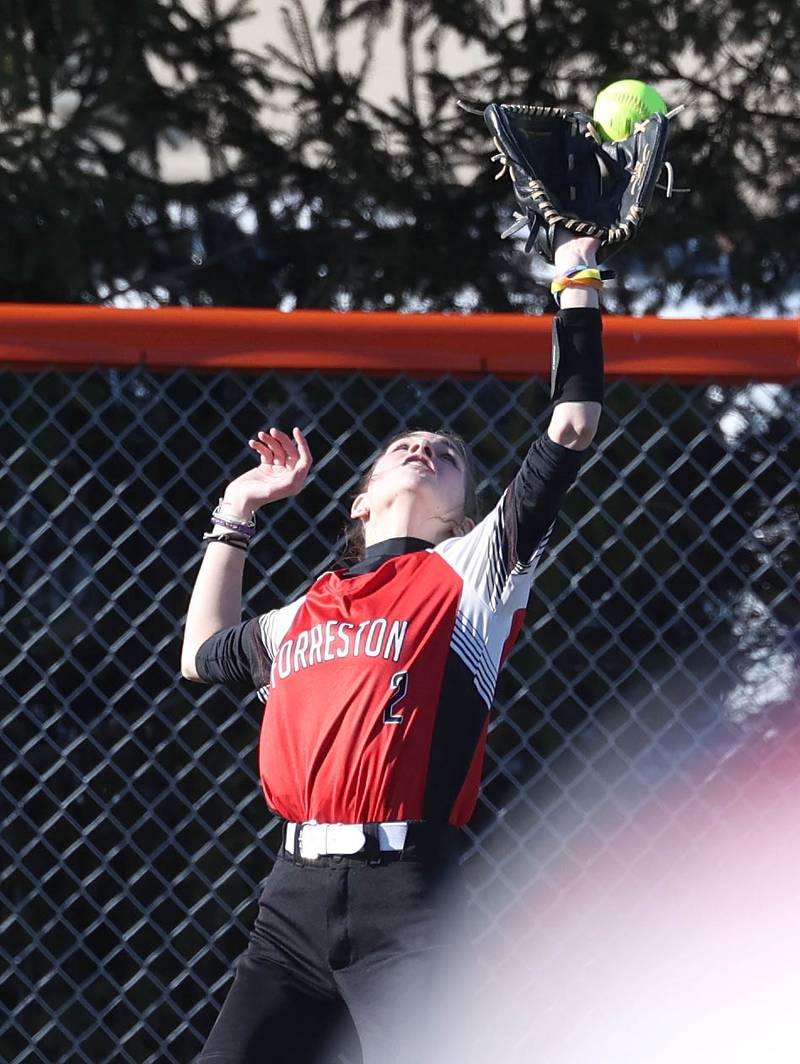 Forreston’s Evvy Bamburg reaches for a fly ball during their game against Genoa-Kingston Friday, March 15, 2024, at Genoa-Kingston High School.