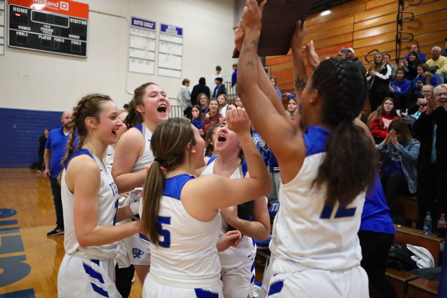 The Princeton Tigresses celebrate Saturday's championship game victory at the Princeton Holiday Tournament.