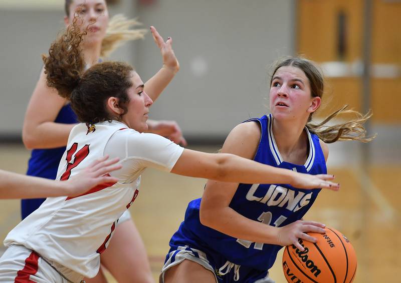 Lyons Township’s Evie Riopell (right) goes to the basket as Benet’s Benet’s Macy Menendez defends during a game on November 18, 2025 at Benet Academy in Lisle.