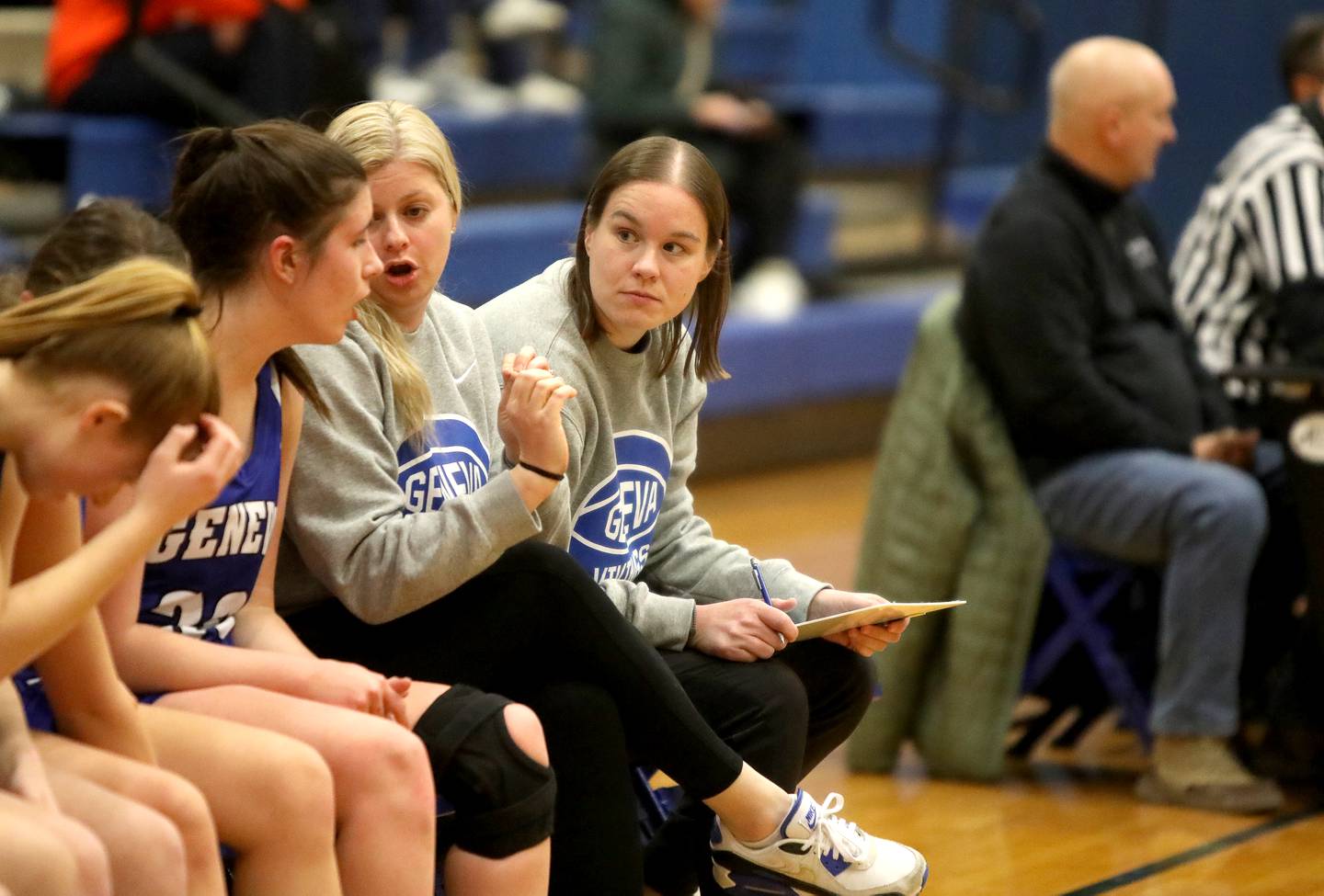 Cailla Swanson (far right), a learning behavior specialist at Geneva High School, also works as an assistant coach with the school’s girls varsity basketball team.
