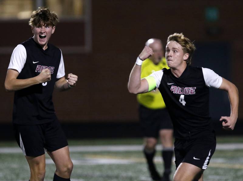 Prairie Ridge's Seth Matson (right) celebrates a goal with teammate, Matthew Fireng during the IHSA Boys Soccer 2A Grayslake Central Sectional semifinal match against Crystal Lake Central on Tuesday, Oct. 29, 2024, at Grayslake Central High School.
