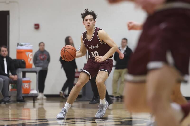 Lockport’s Evan Dziadkweic looks for a play against Lincoln-Way Central on Tuesday, Jan. 23rd, 2024 in New Lenox.