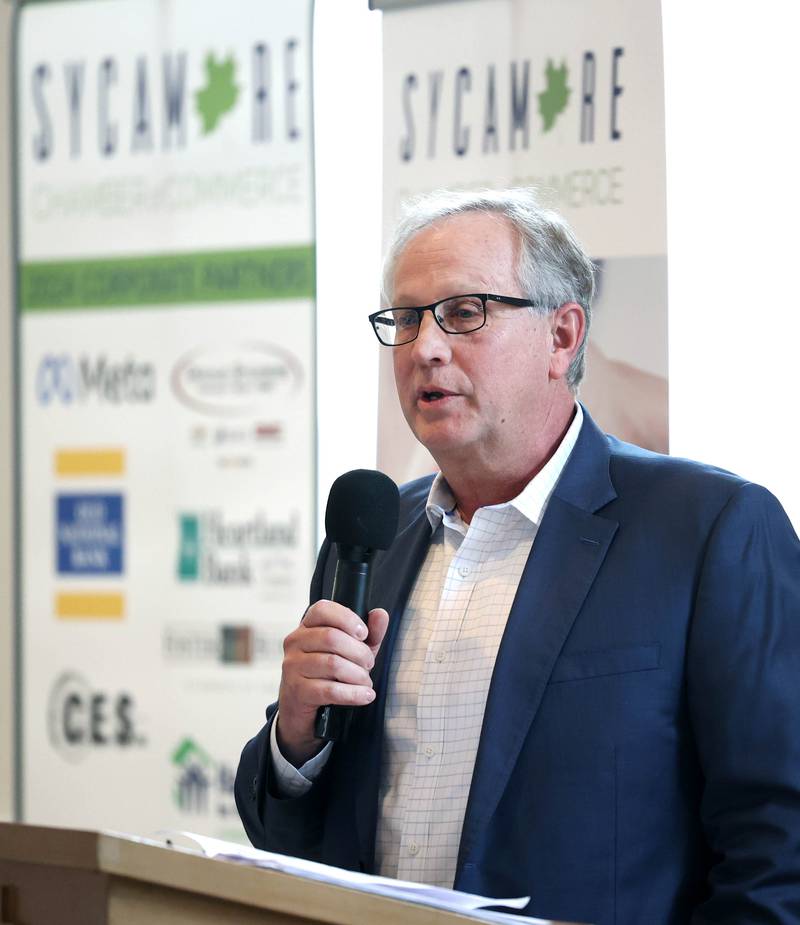 School Tool Box President and CEO Doug Stice (left) speaks after accepting the Outstanding Business of the Year award during the 107th Annual Sycamore Chamber of Commerce Meeting Thursday, March 7, 2023, in Memorial Hall at St. Mary's Catholic Church in Sycamore.
