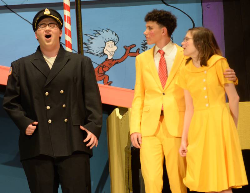 Oregon High School Senior Isaac Kramer (left) hits a note as he  performs as General Genghis Khan Schmidtz with Elliot Peeling and Eleanor Guinn as Mr. and Mrs. Mayor during the school's presentation of "Seussical The Musical" on Friday, March 14, 2025 in the OHS Theater.
