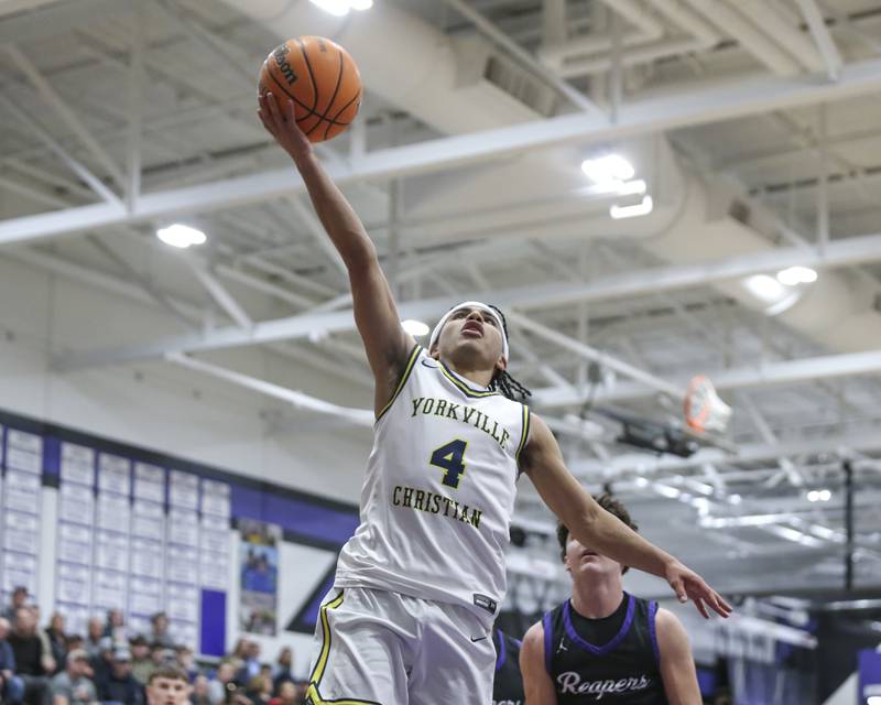 Yorkville Christian's Tray Alford (4) puts in a lay up during their Plano Christmas Classic semi-final basketball game between Yorkville Christian at Plano Monday, Dec 29, 2025 in Plano.