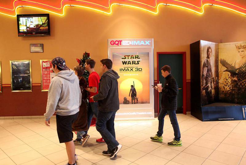 Fans enter the theater for the first showing of "Star Wars: The Force Awakens" at the Randall 15 IMAX movie theater in Batavia Thursday. (Sandy Bressner photo)