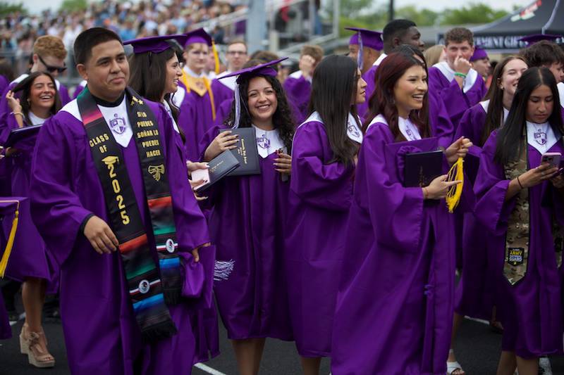 Downers Grove North graduates are all smiles after  the Commencement Ceremony on Sunday, May 18, 2025 in Downers Grove.